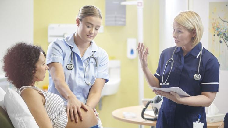 pregnant woman and nurses