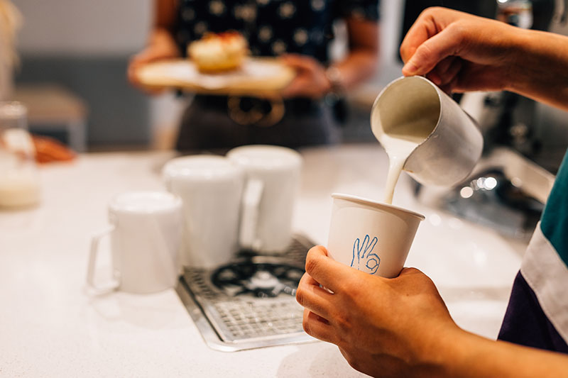 Making coffee at Oh Donuts