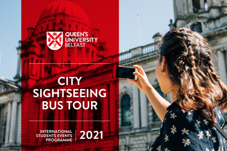 Student uses her mobile phone camera to take a photo of City Hall in Belfast