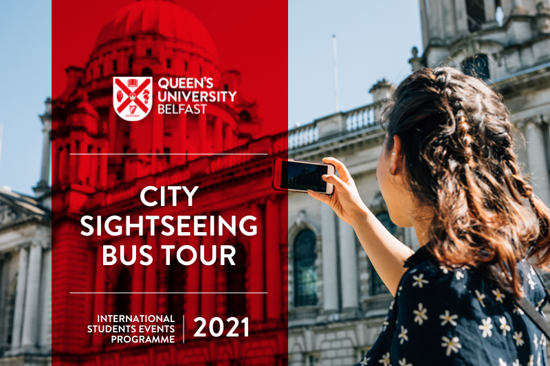 Student uses her mobile phone camera to take a photo of City Hall in Belfast