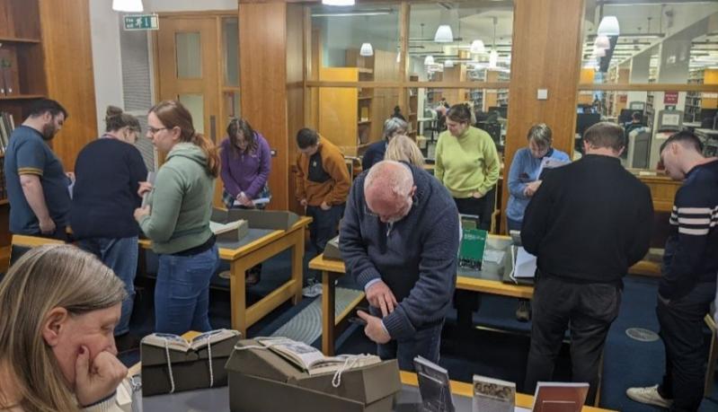 A Group of people studying documents