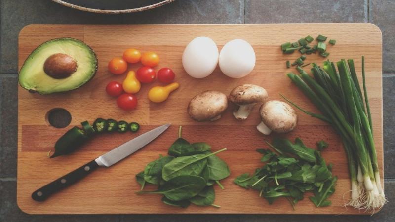 Chopping board with fresh ingredients on top