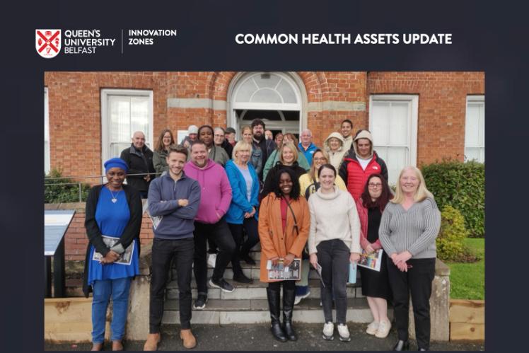 C.H.A. Team on steps outside a red brick building