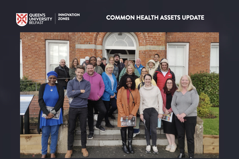 C.H.A. Team on steps outside a red brick building