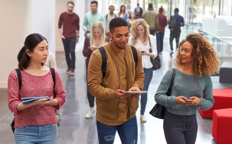 Students talk to each other en route