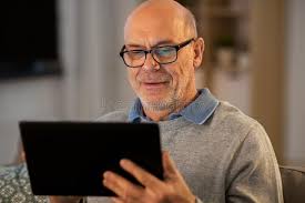 older man at ipad