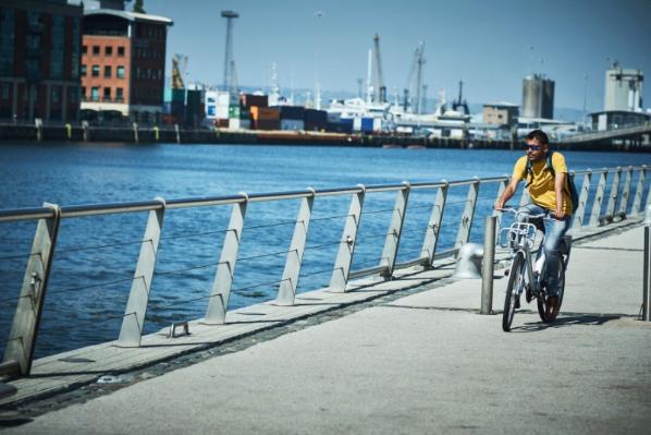 Person cycling by the Lagan river