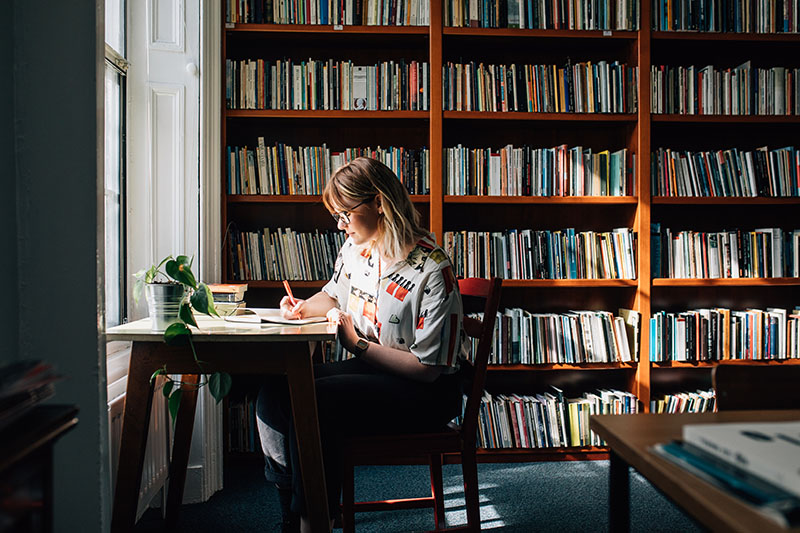 A student sits at a desk