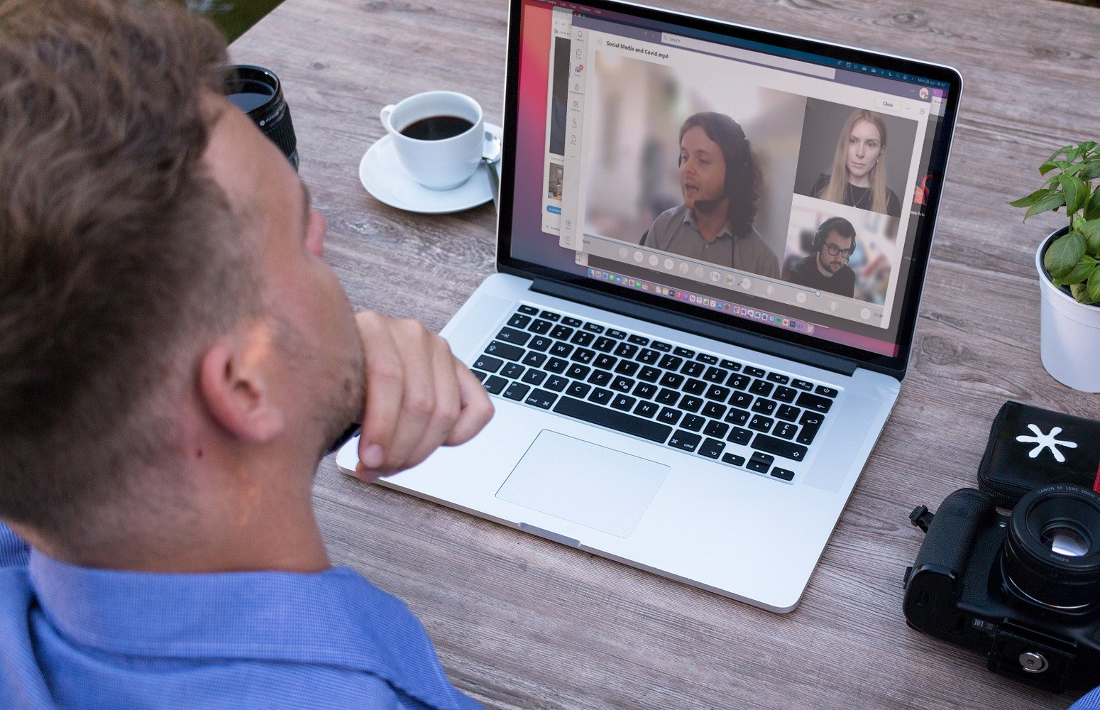 Photo of person sitting at laptop