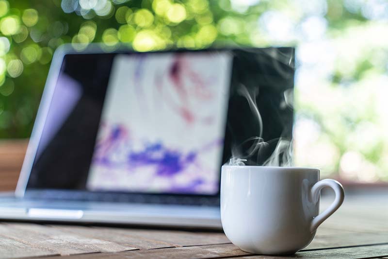 Laptop and a mug