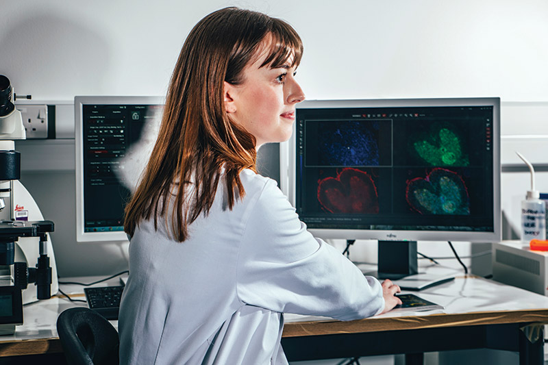 Female researcher at a computer