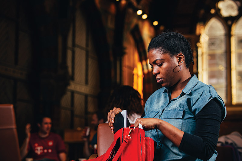 Student in the Graduate School packing a bag