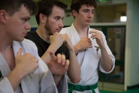 Three lads practice Tai Jitsu
