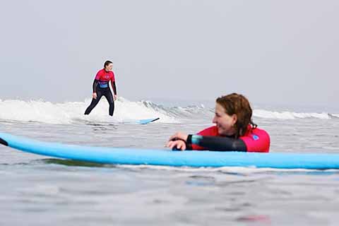 Tessa surfing