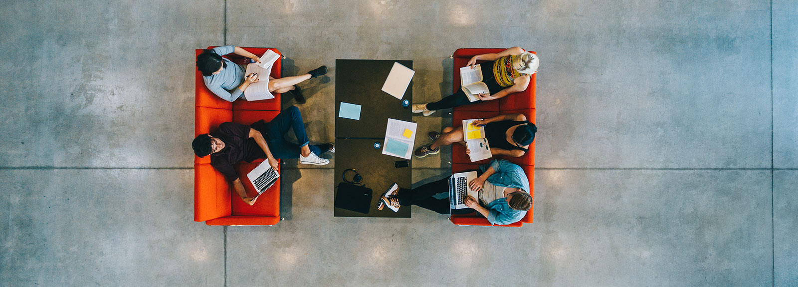 People seated at a table photographed from above