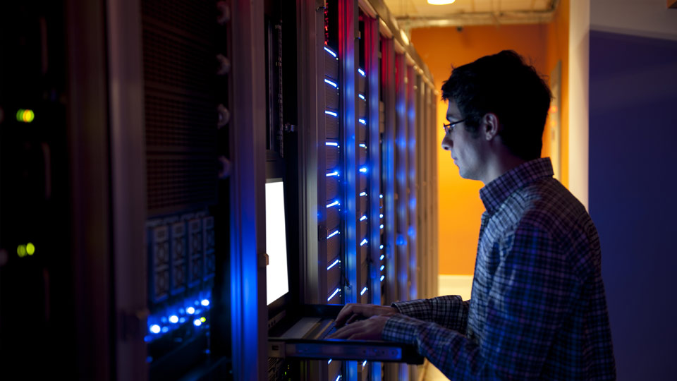 Man standing in computer server room