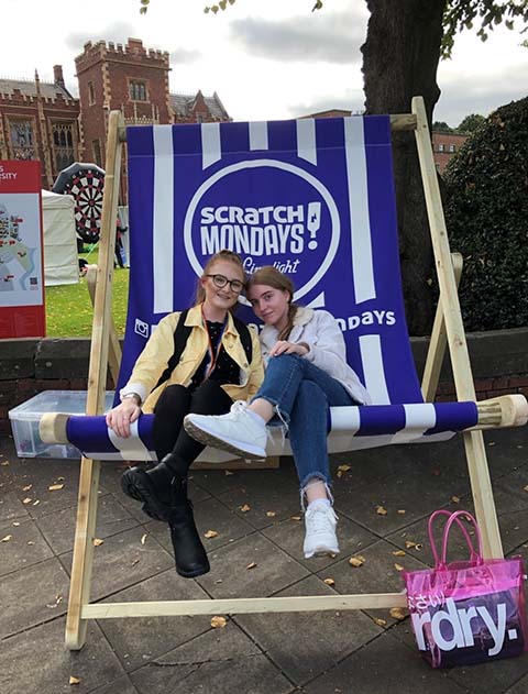 Georgia and friend on a big deck chair