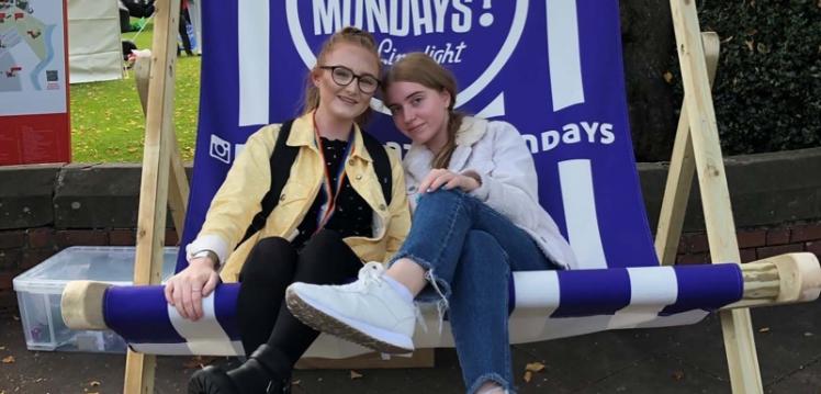 Georgia and friend on a big deck chair