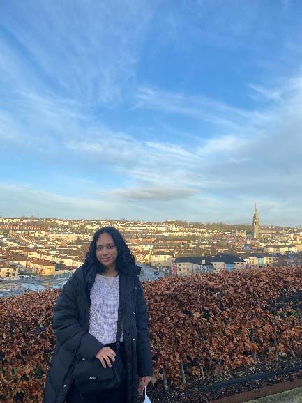 Sumita with views of Derry behind her