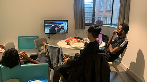 students watching tv