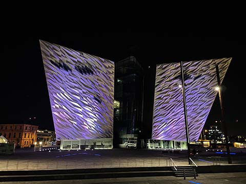 The Titanic building lit up at night