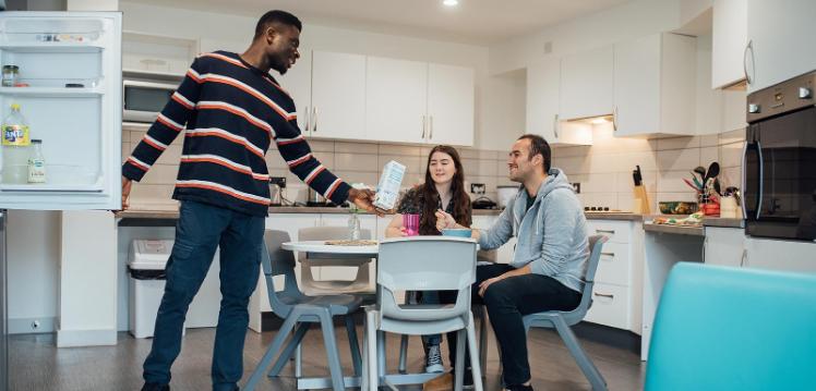 Students at a table in the kitchen of Elms BT1