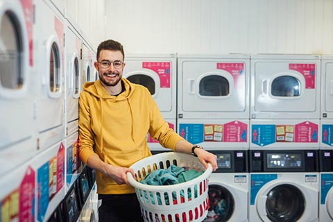 Student in the laundry room in BT9