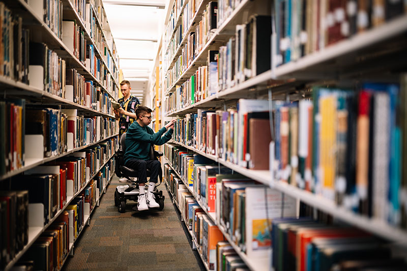 Roudy and Patrick in the library