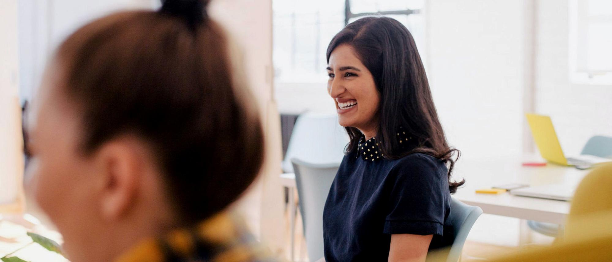 woman smiling in a classroom