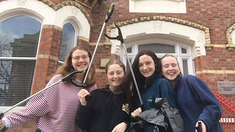 Kathryn and her friends with litter pickers