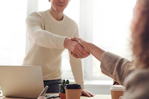 Handshake over a table