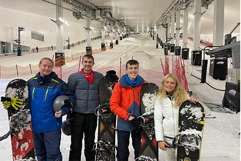 Group of students snowboarding