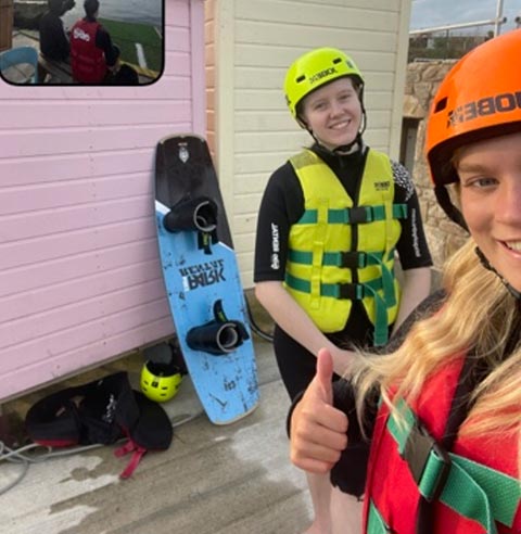 Students smiling at wakeboarding