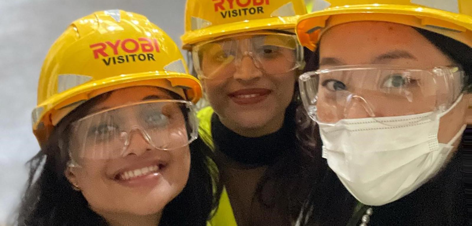 Three MBA students in hard hats