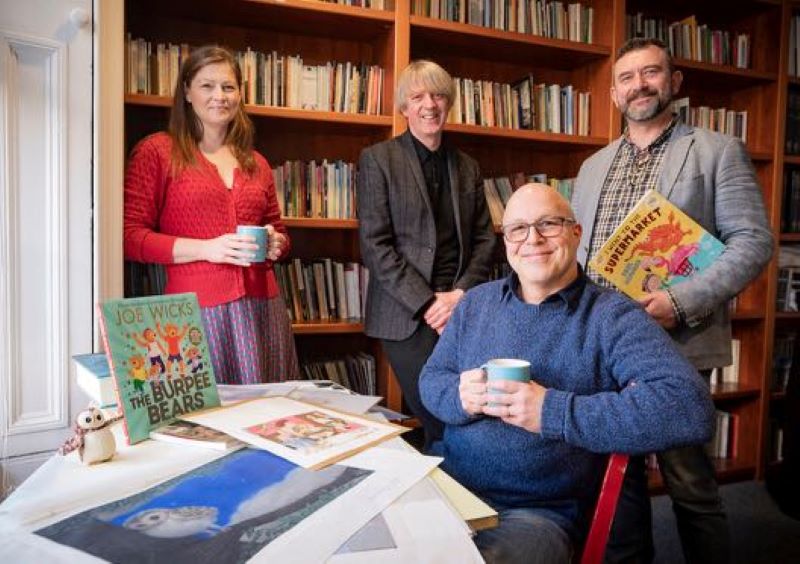 Children's Writing Fellow Paul Howard, seated at book event, with colleagues