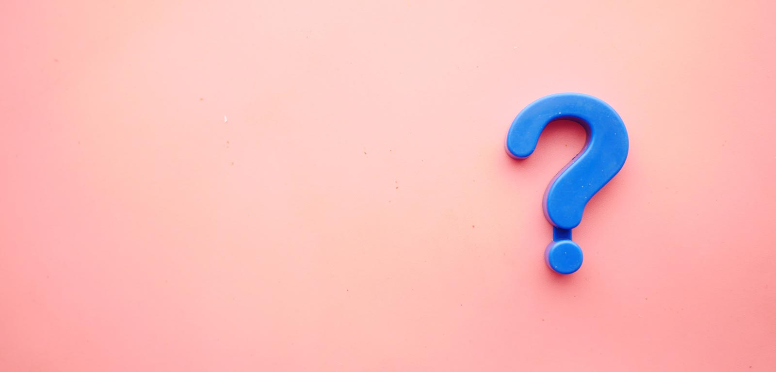 blue question mark on a pink background