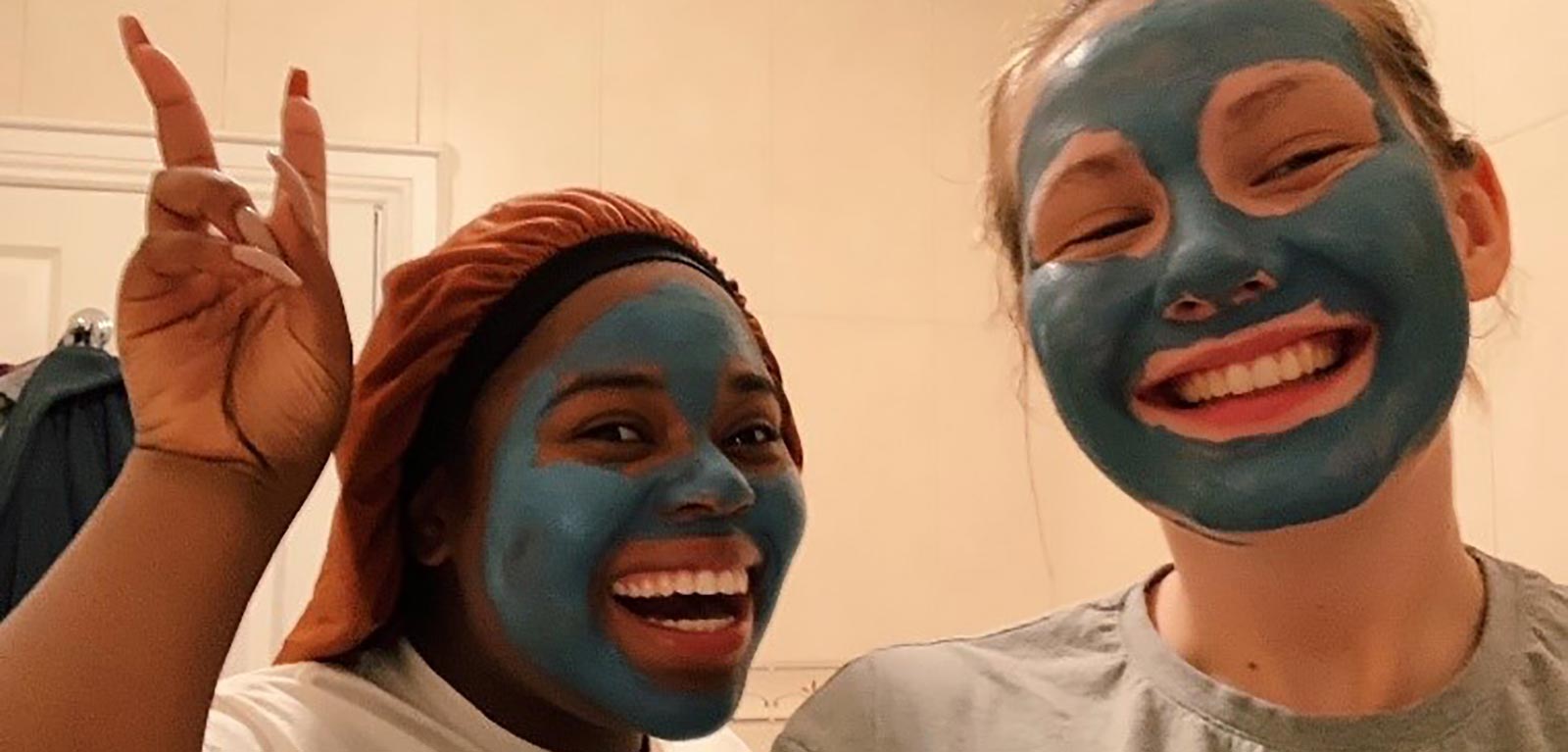 Kathryn and her friend in face masks