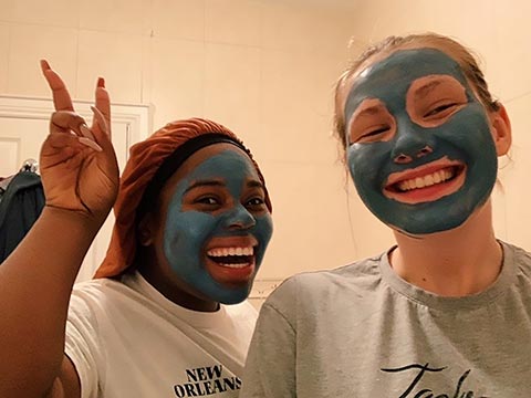 Kathryn and her friend in facemasks