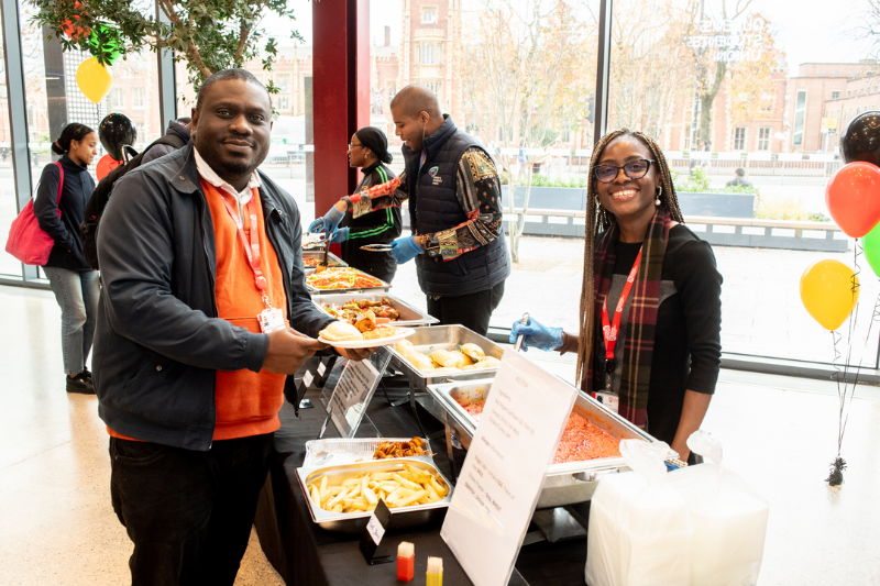 Research scholar serving food