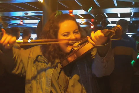 Suzanne's friend playing the violin