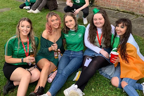 Suzanne and friends on Paddy's day on the grass
