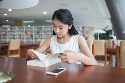 Chinese student reading a book
