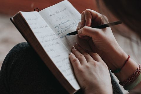 Person writing in a journal
