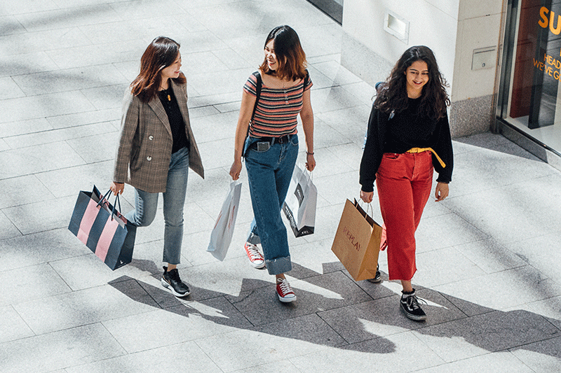 Three students shopping