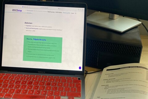 OCSE study layout with laptop and book