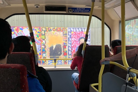 Bus tour of West Belfast showing a mural on wall