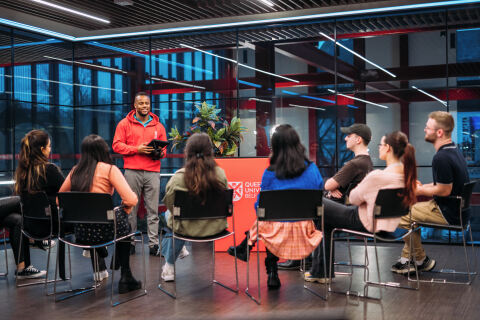 Students at a services meeting at Queen's