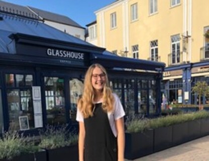 Student in front of cafe in Lisburn