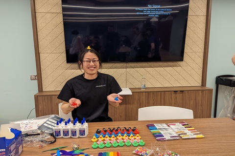 Student participating in rubber duck decorating contest