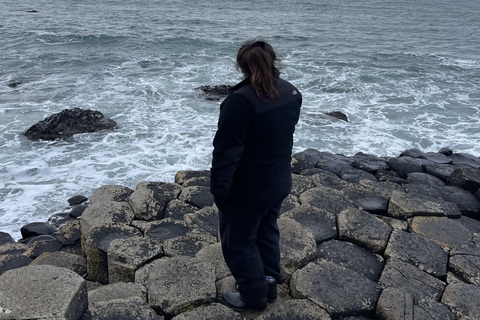 Student standing at Giants Causeway